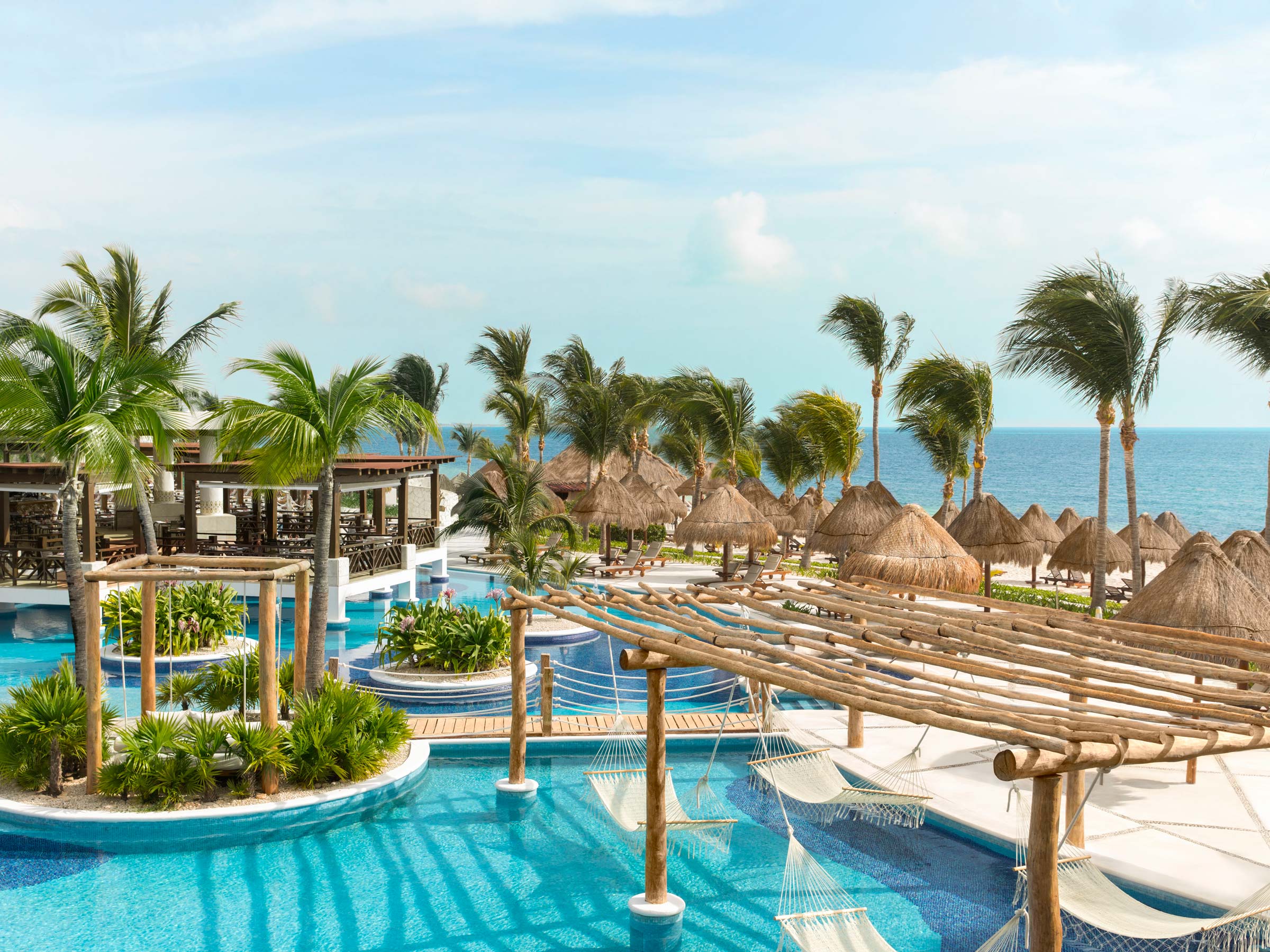 Excellence Playa Mujeres adults-only all-inclusive luxury resort with beachfront pools, modern suites, and pristine Playa Mujeres beach near Cancun.