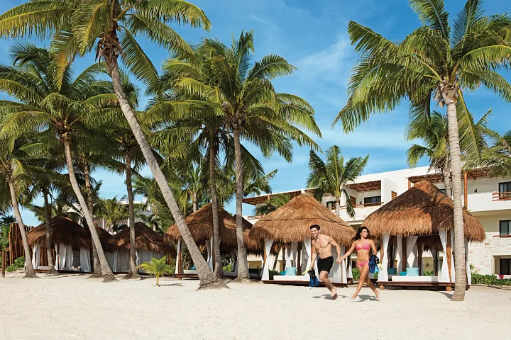 secrets-akumal-beachfront-cabanas-palm-trees