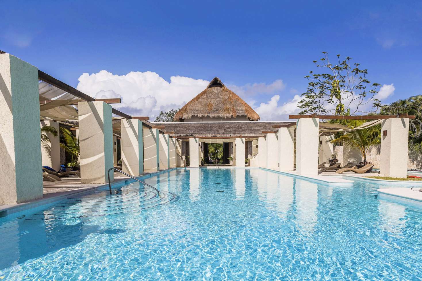 TRS Yucatan Hotel adults-only all-inclusive resort with infinity pools, modern suites, and beachfront luxury in the Riviera Maya.