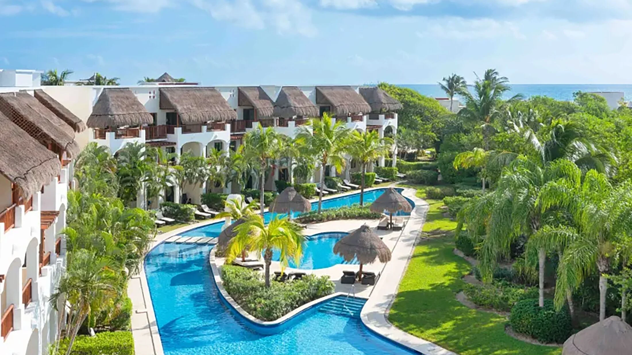 Valentin Imperial Riviera Maya adults-only all-inclusive resort with colonial-style architecture, lush gardens, and beachfront pools near Playa del Carmen.